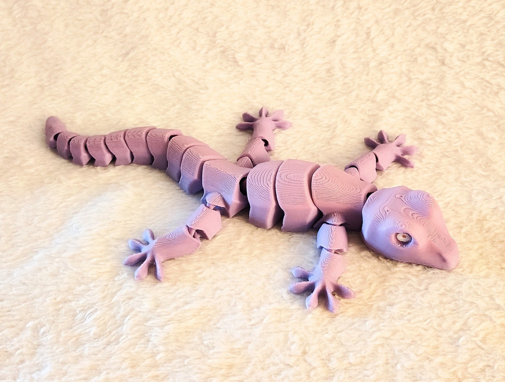 3D Printed Light Pink Flexi 8 Inch Gecko. Printed With PLA Filament